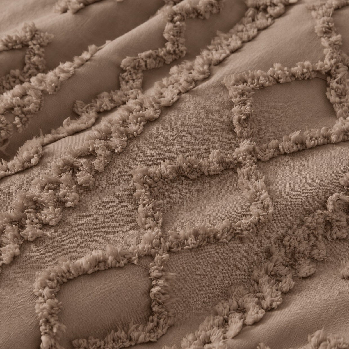 Tufted comforter detail, Brown